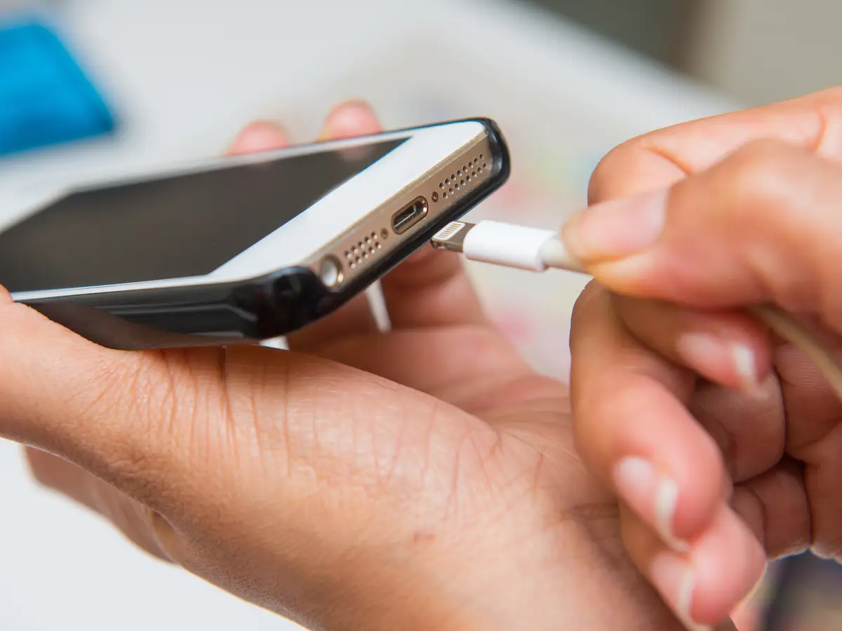 Certified technician collecting iPhone for battery replacement in Johannesburg South