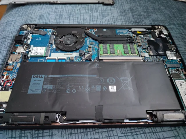 Laptop battery replacement Johannesburg - professional technician replacing laptop battery with genuine parts