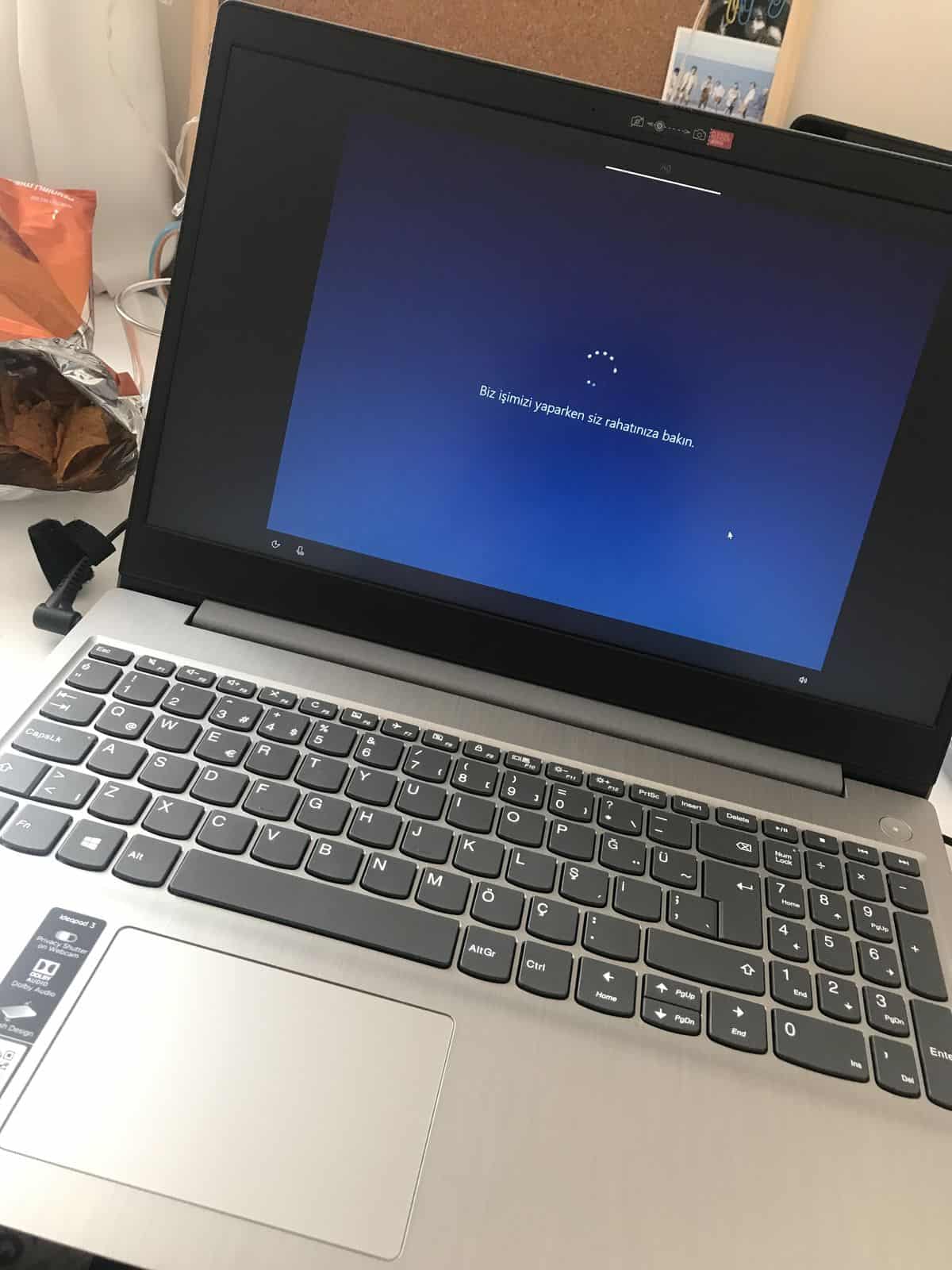 Detailed view of a laptop cooling fan full of dust causing overheating