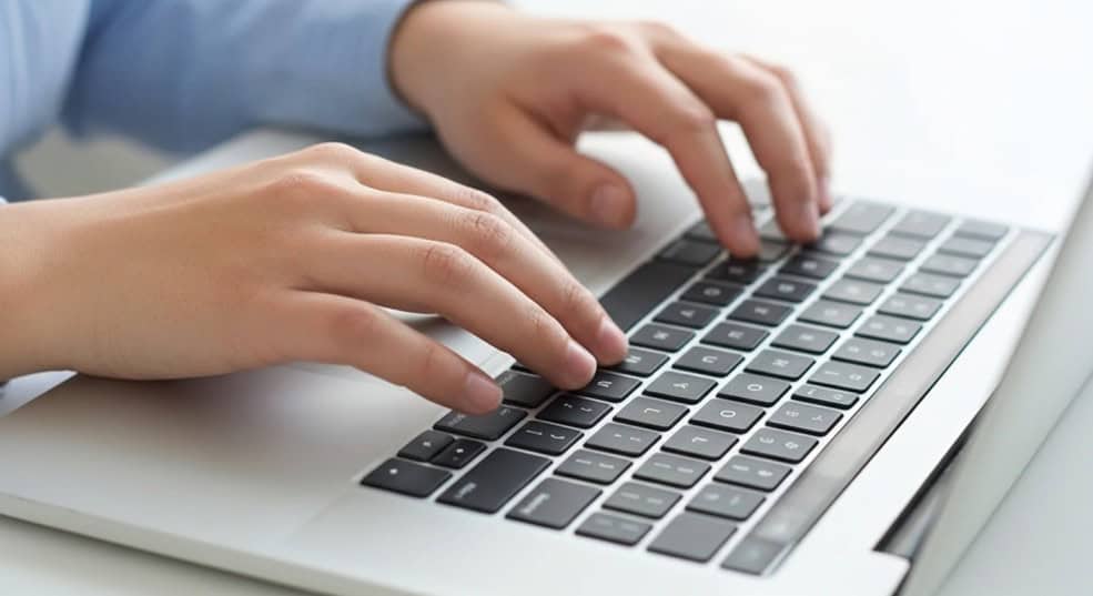 Technician replacing a MacBook Pro keyboard